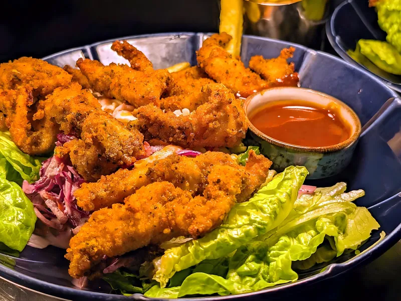 Crispy chicken goujons with slaw, chips and a dipping sauce