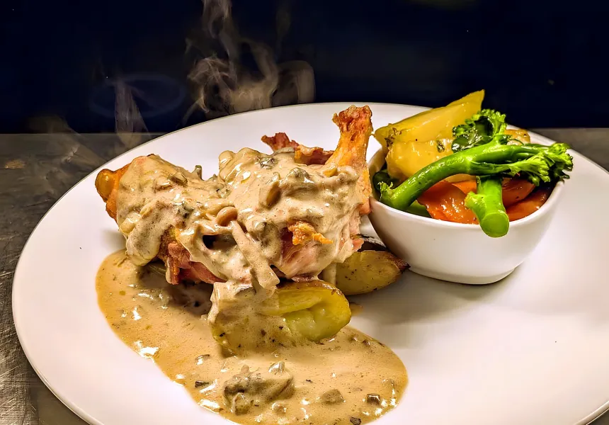 Irish chicken supreme in wild mushroom sauce with seasonal vegetables