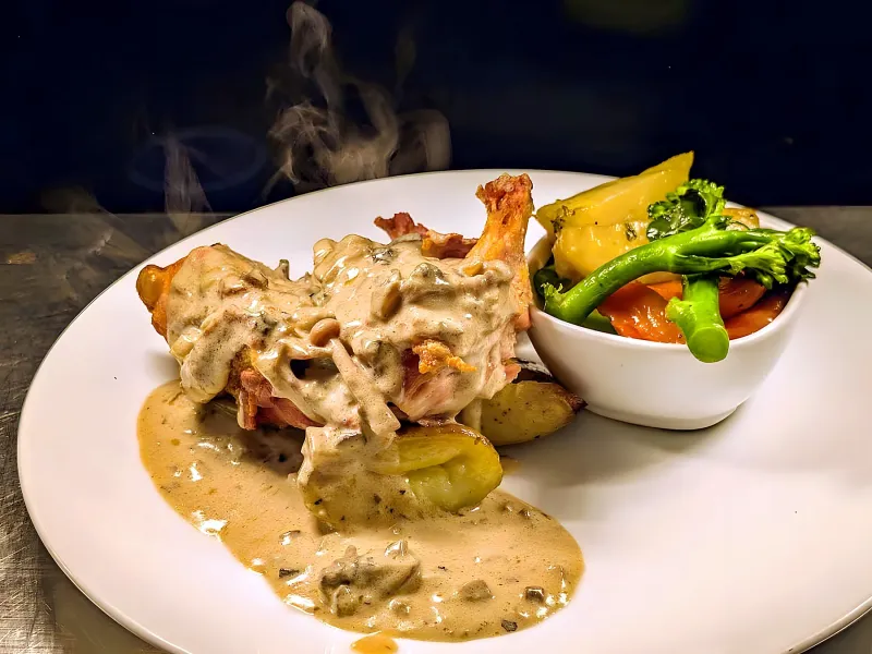Irish chicken supreme in wild mushroom sauce with seasonal vegetables