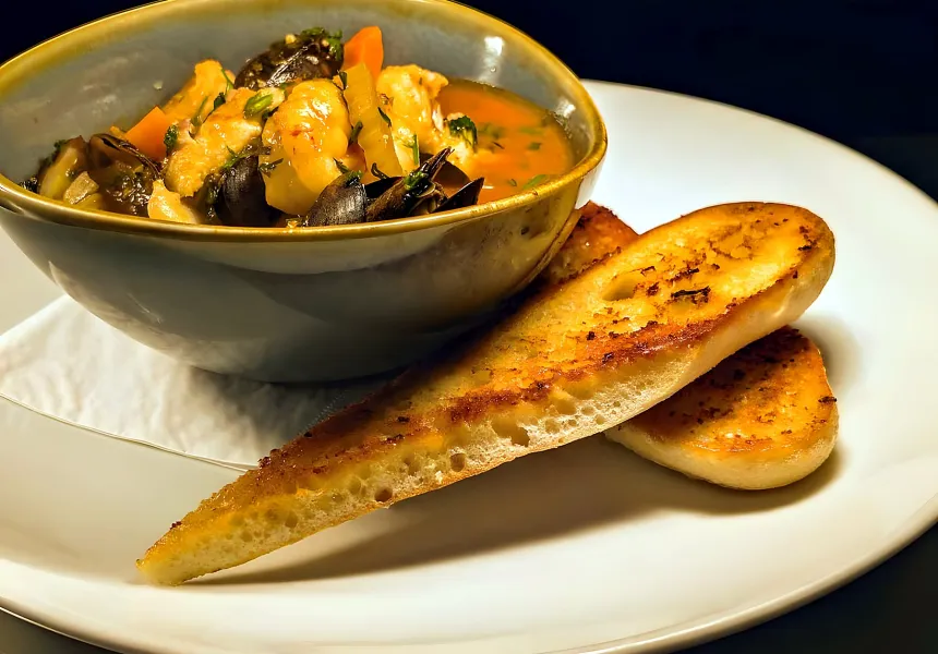 Wild Ways tomato-based seafood chowder with garlic bread