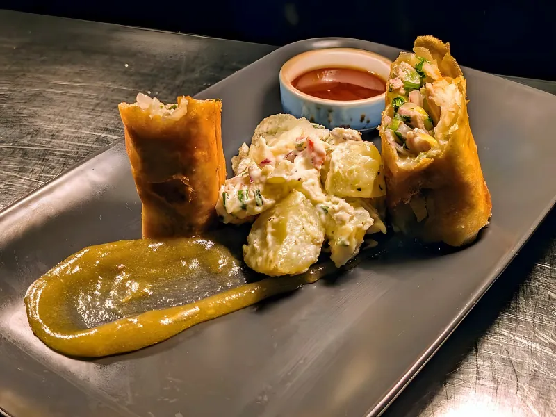 Squash and beetroot spring roll with apple ketchup and potato salad